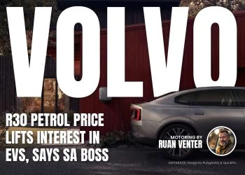 Volvo home wall charger beside electric sedan at house - Saffarazzi Volvo home wall charger beside electric sedan at house
