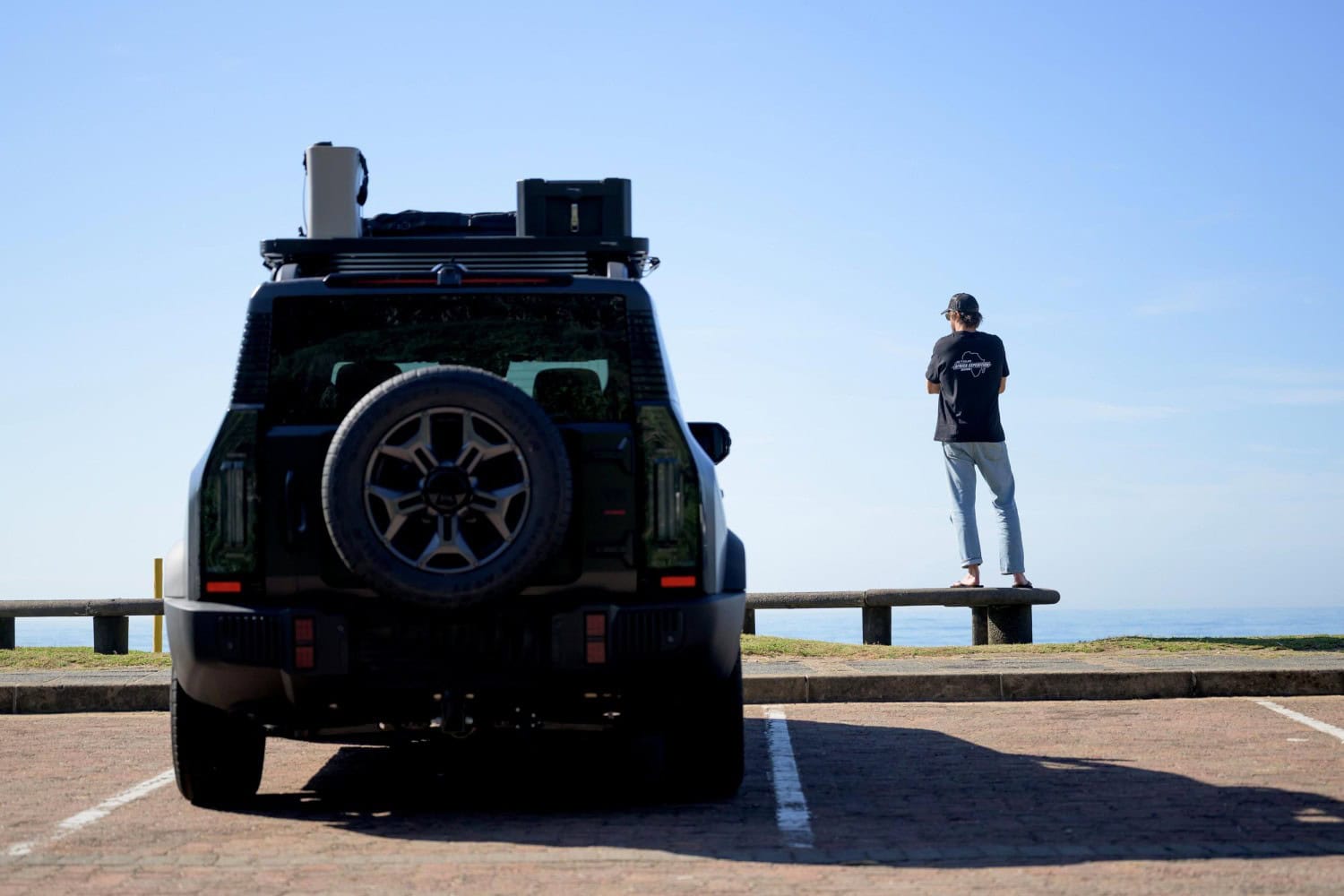 Rear view of Jetour T2 parked by the sea.