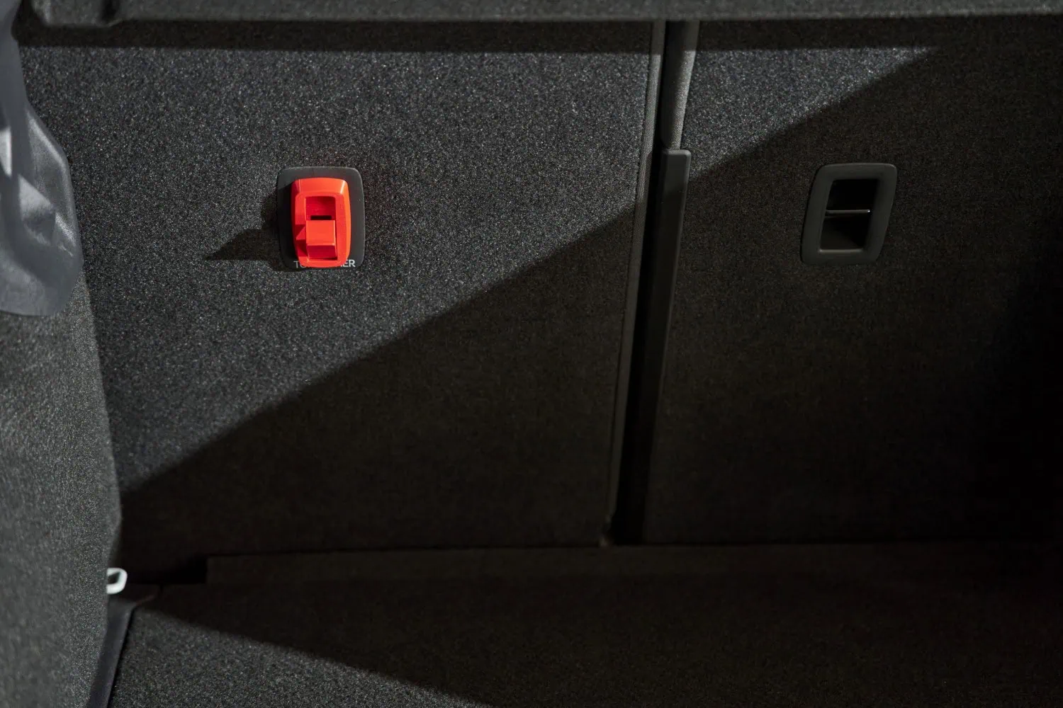 Red boot wall clip - Saffarazzi Red 3D-printed Škoda cover on boot wall.