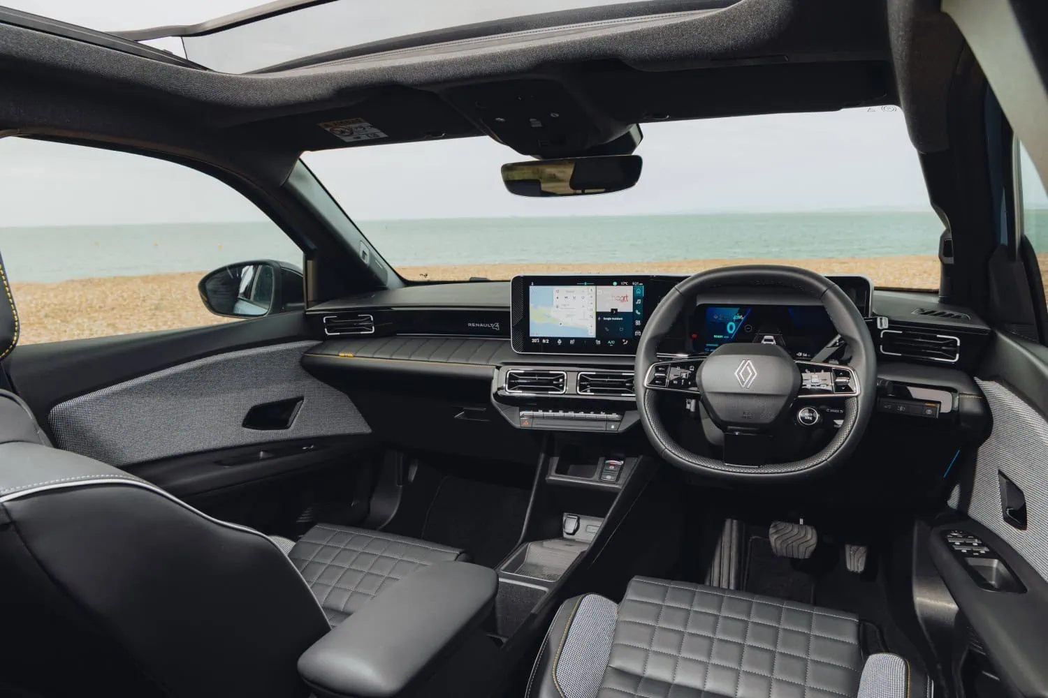 Renault 4 interior cabin - Saffarazzi Renault 4 E-Tech electric interior and dashboard by the sea.