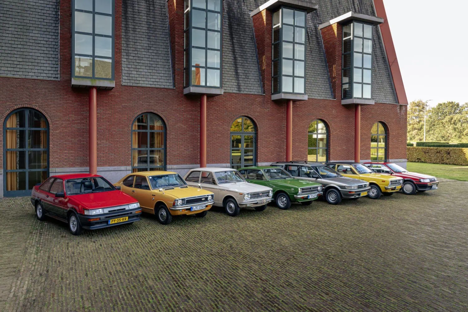 Classic Corollas in a row - Saffarazzi Seven classic Toyota Corolla generations parked in a row.