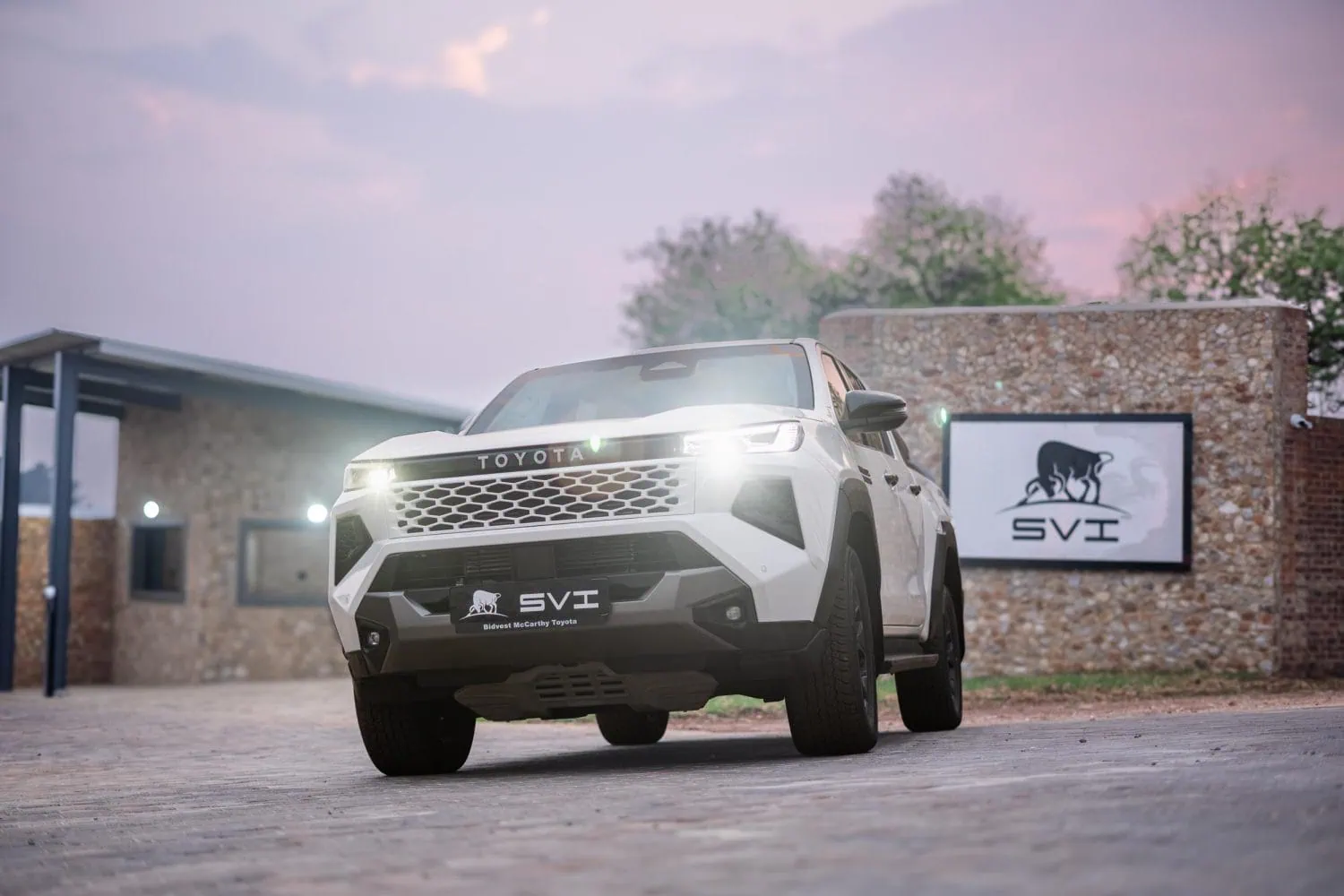 SVI Hilux armoured bakkie low front view with headlights - Saffarazzi SVI Hilux armoured bakkie low front view with headlights