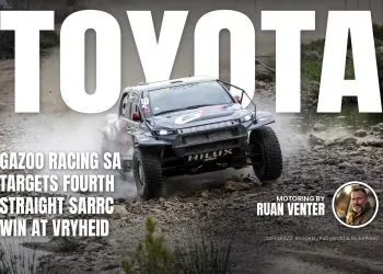 Toyota GR Hilux IMT EVO splashing through rocky river crossing