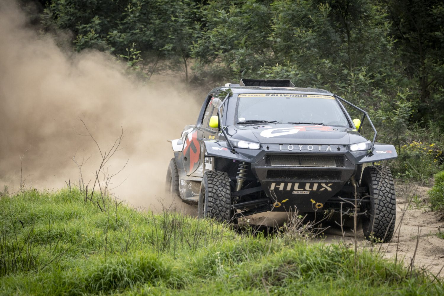 Toyota GR Hilux IMT EVO cornering on sandy bush trail - Saffarazzi Toyota GR Hilux IMT EVO cornering on sandy bush trail