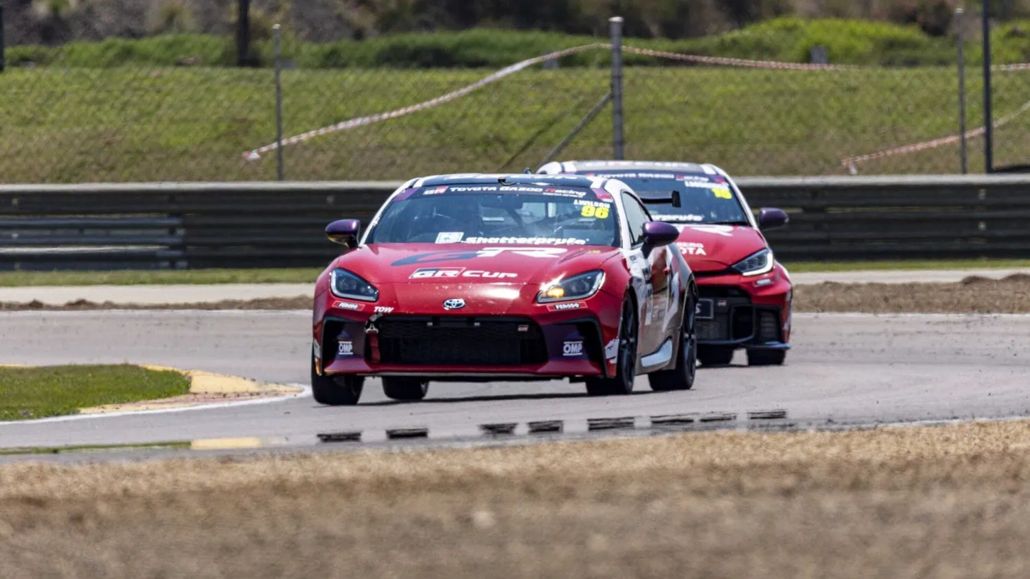 GR86 ahead of GR Yaris - Saffarazzi Toyota GR86 leading a Toyota GR Yaris through a bend.