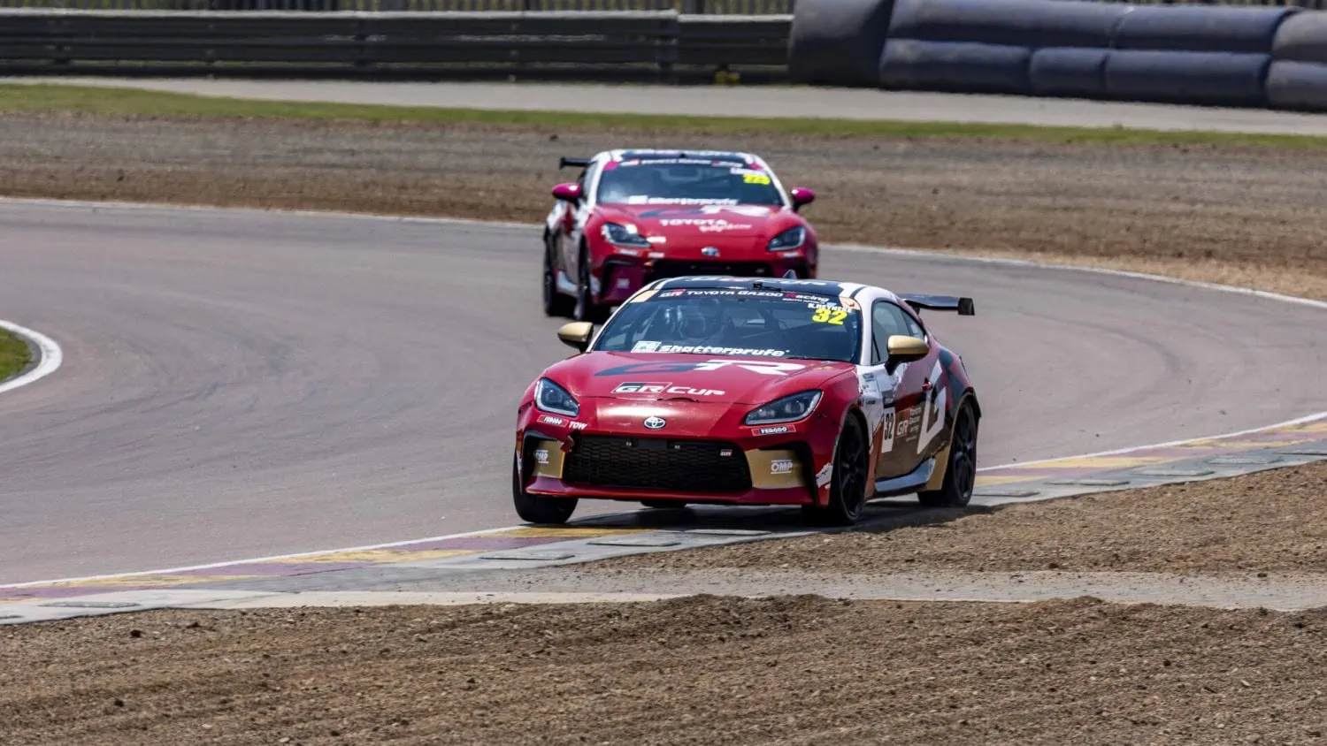 Two GR86 racers in line - Saffarazzi Two Toyota GR86 GR Cup cars on track.