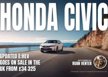 Honda Civic e:HEV hatchback driving on coastal road