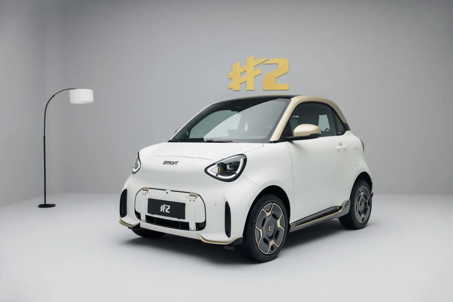White smart #2 front three-quarter view under #2 sign - Saffarazzi White smart #2 front three-quarter view under #2 sign